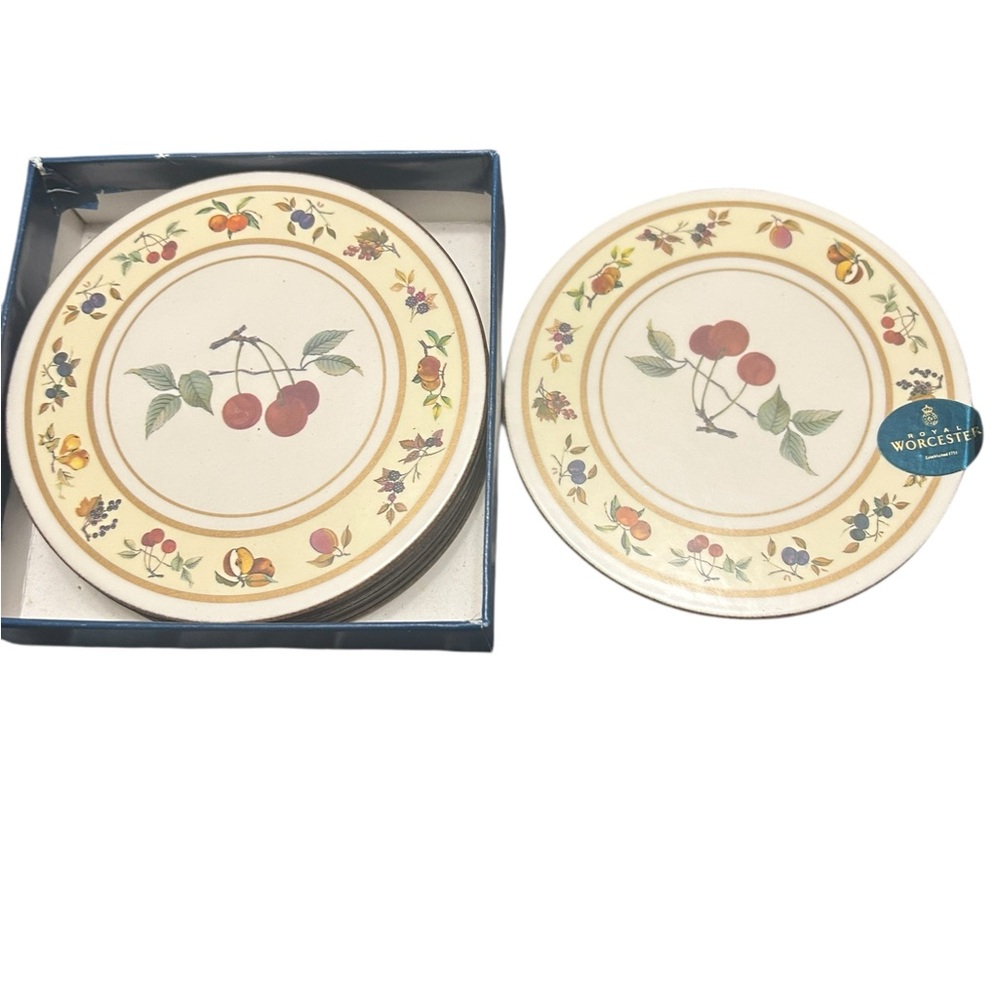 Vintage Royal Worcester Evesham coasters with a fruit pattern and cork backing.